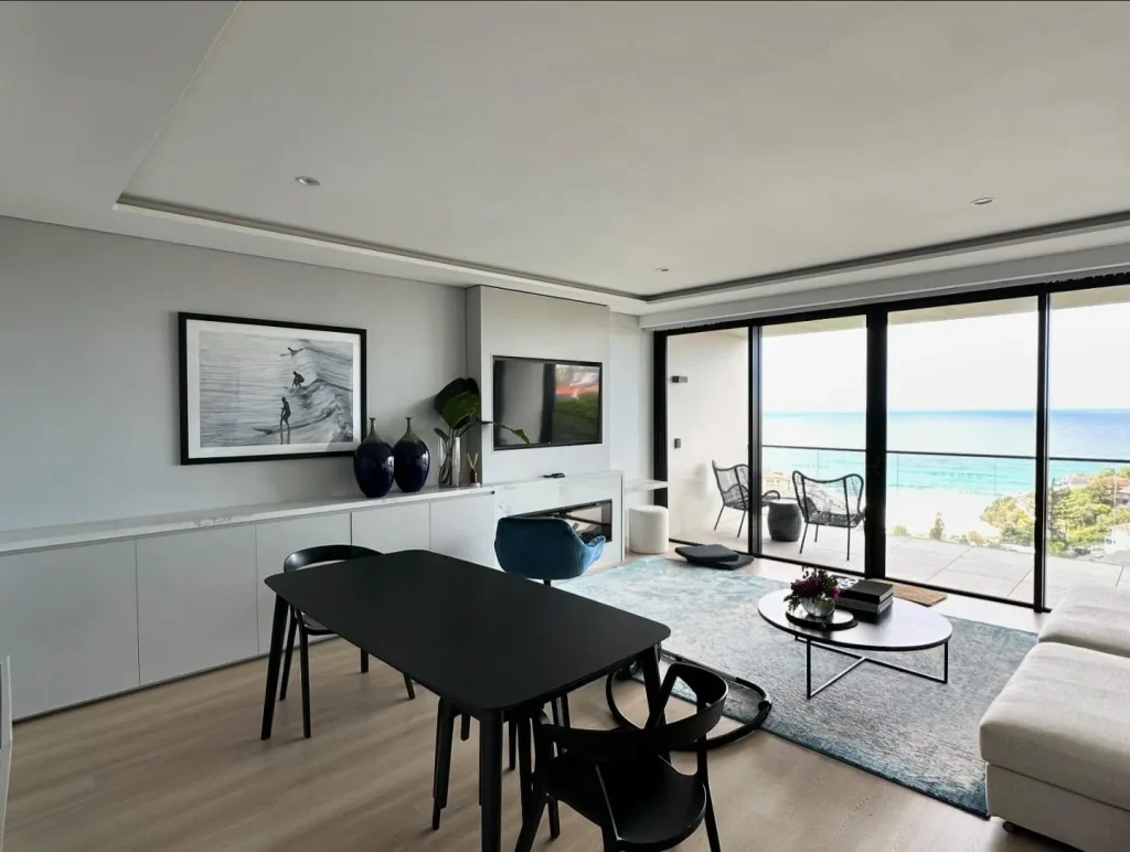 Renovated apartment living area with ocean view