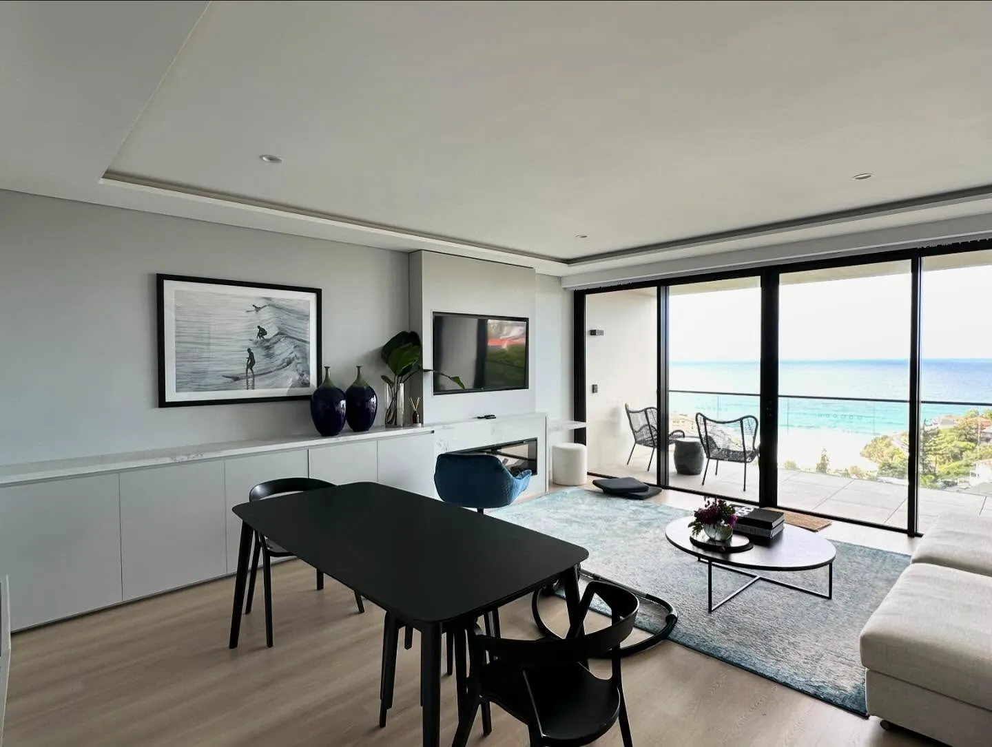 Renovated apartment living area with ocean view