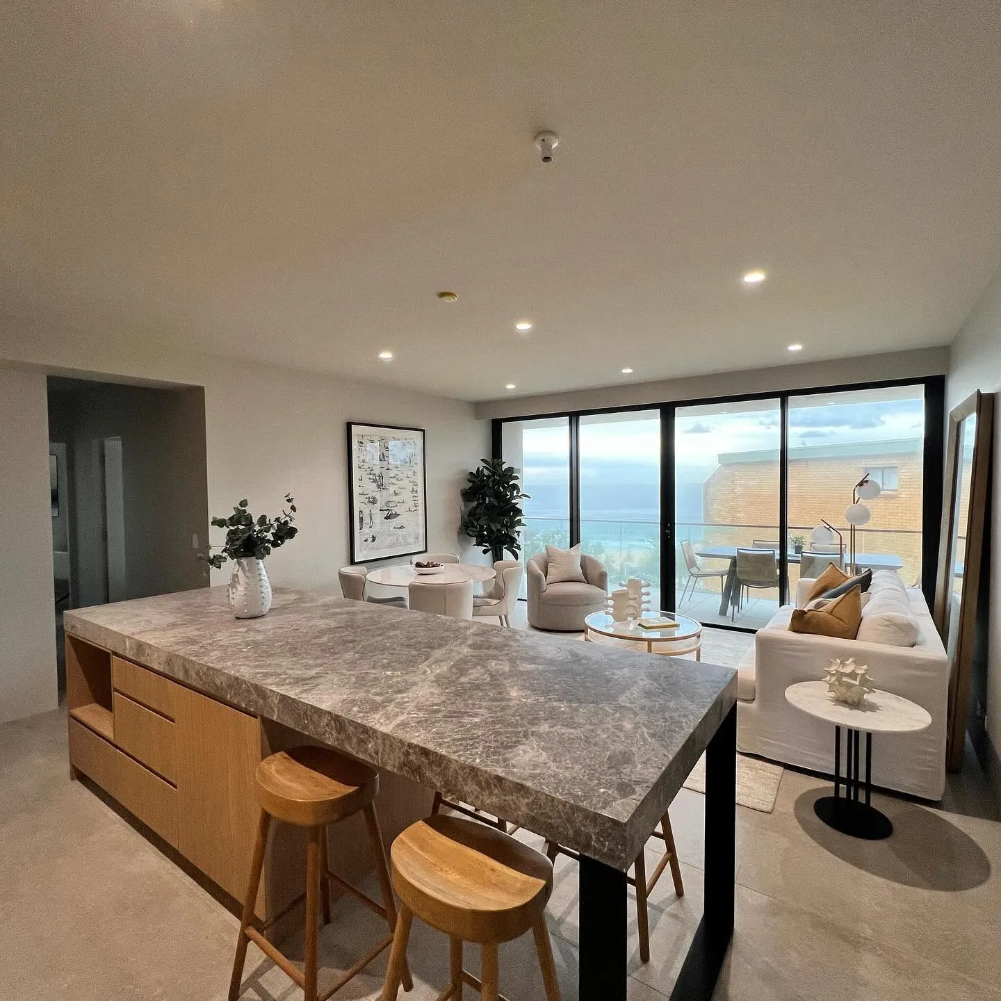 Renovated kitchen with a stone island bench