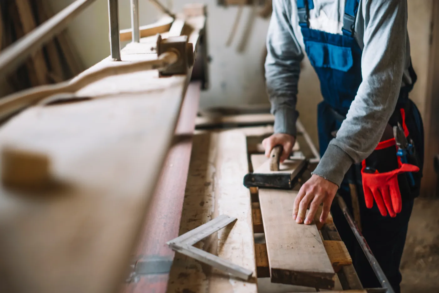 Carpenter working on timber boards